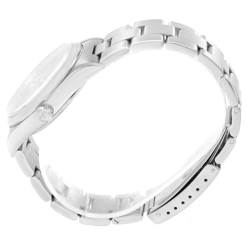 The image shows the side profile of a Rolex Air-King 14000 Men's Stainless Steel Blue Dial 14000 Men's Stainless Steel Blue Dial watch, highlighting its case, crown, and metal bracelet.