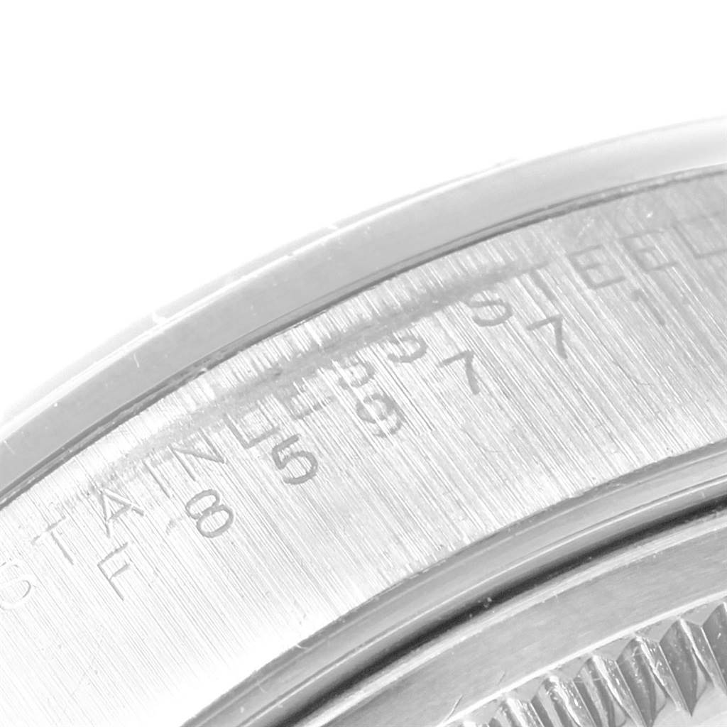 This image shows a close-up of the engraved serial number and "Stainless Steel" text on the side of a Rolex Air-King 14000 Men's Stainless Steel Blue Dial 14000 Men's Stainless Steel Blue Dial watch case.