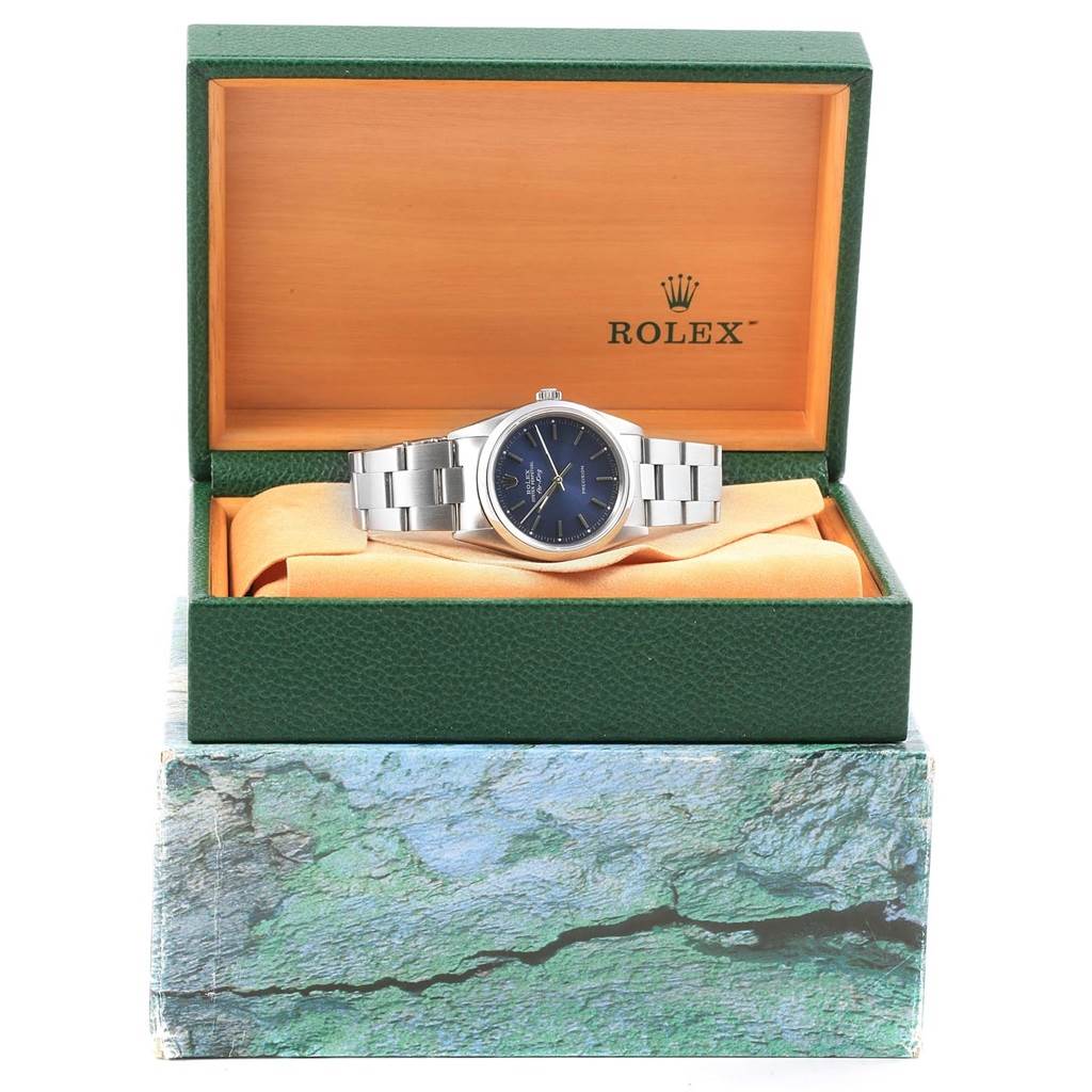 The Rolex Air-King 14000 Men's Stainless Steel Blue Dial 14000 Men's Stainless Steel Blue Dial watch is shown from the front, displayed in an open green and orange Rolex box.