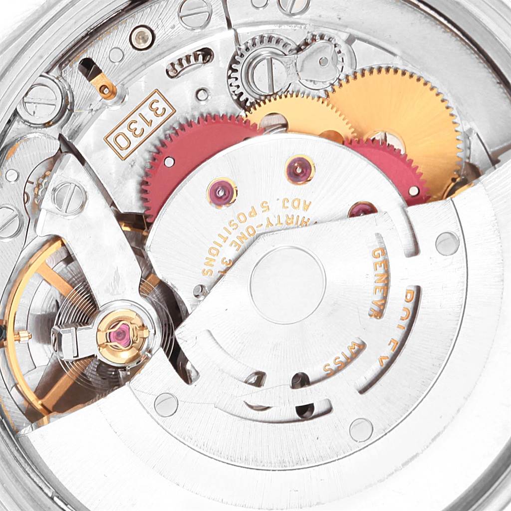 The image shows a close-up of the movement mechanism inside a Rolex Air-King 14000 Men's Stainless Steel Blue Dial 14000 Men's Stainless Steel Blue Dial watch, highlighting gears and intricate components.