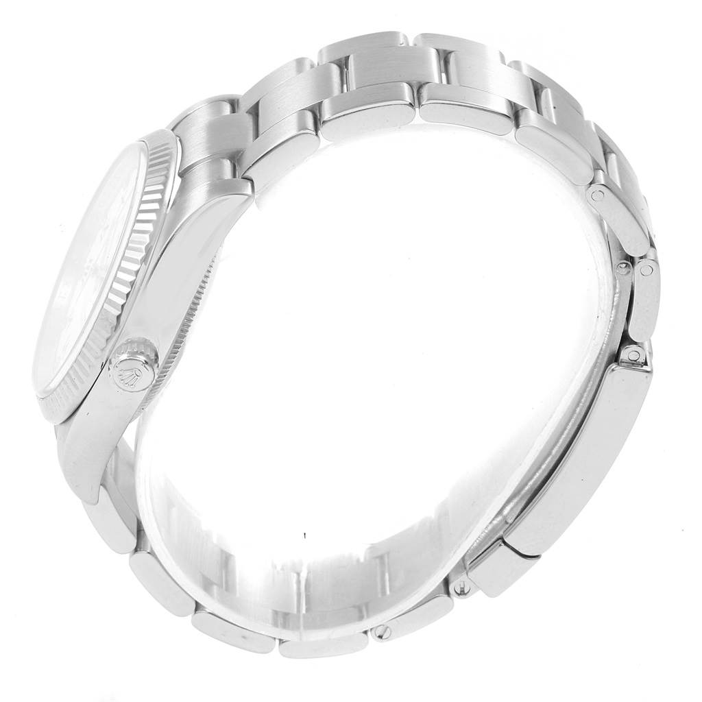 The image shows a side view of the Rolex Air-King 114234 Men's Stainless Steel White Dial 114234 Men's Stainless Steel White Dial watch, highlighting the crown, bezel, and bracelet.