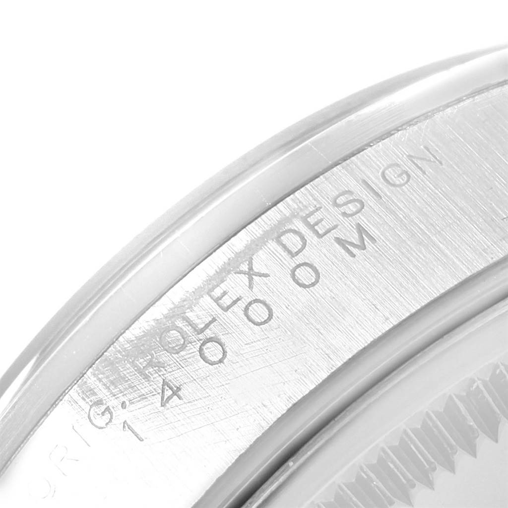 This image shows a close-up of the watch bezel inscribed with "ROLEX DESIGN 14000M" on the Rolex Air-King 14000 Men's Stainless Steel Blue Dial 14000 Men's Stainless Steel Blue Dial model.