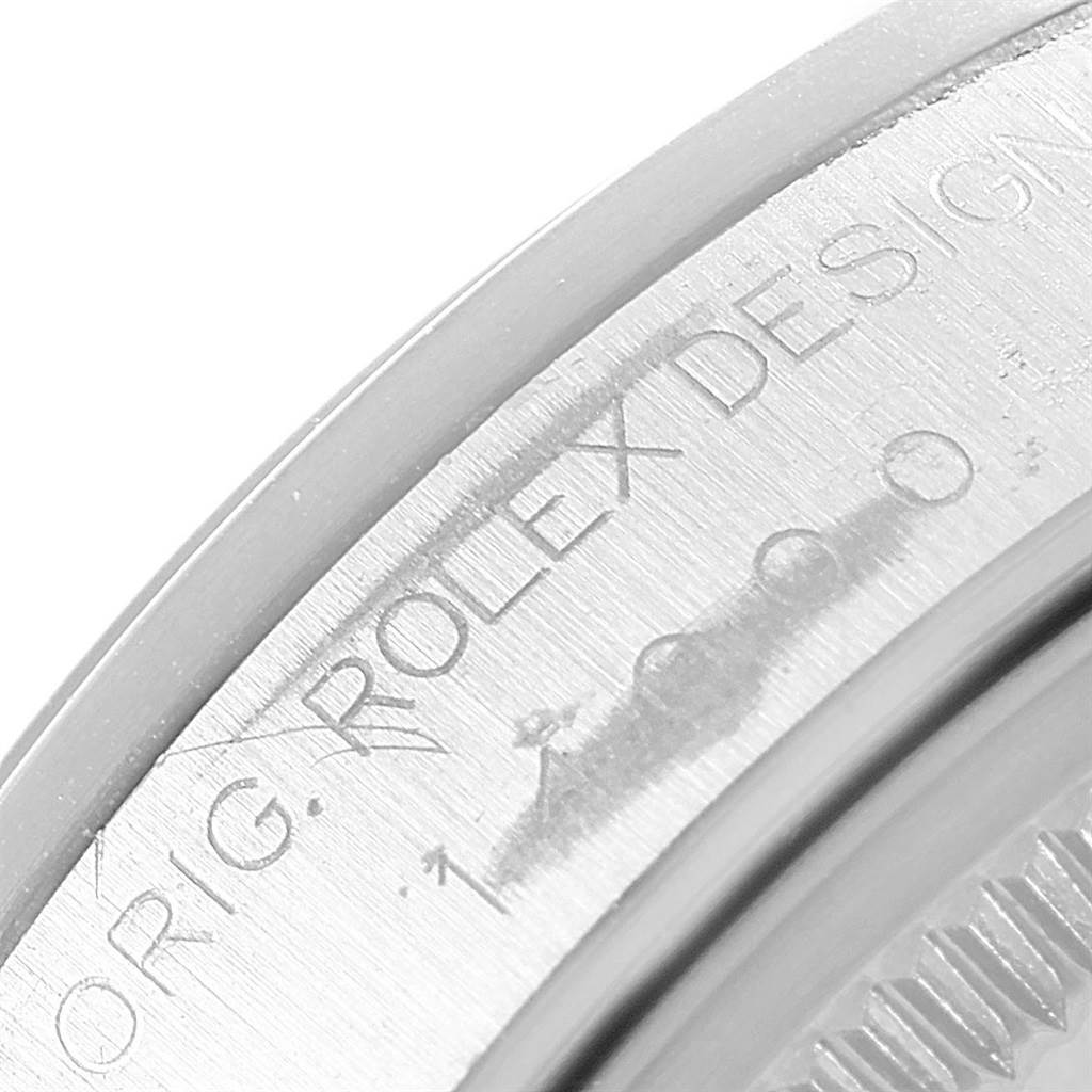 The image shows a close-up of the engraving on the bezel of a Rolex Air-King 14000 Men's Stainless Steel Black Dial 14000 Men's Stainless Steel Black Dial watch.