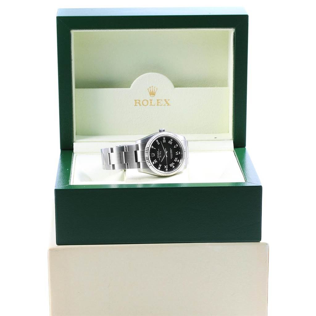 The image shows a front view of a Rolex Air-King 114234 Men's Stainless Steel Black Dial 114234 Men's Stainless Steel Black Dial watch inside its open green presentation box.