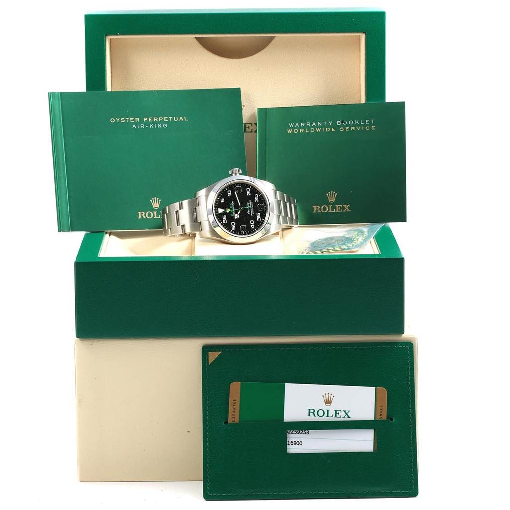 The image shows a Rolex Air-King 116900 Men's Stainless Steel Black Dial 116900 Men's Stainless Steel Black Dial watch with its box, manuals, warranty booklet, and additional accessories.