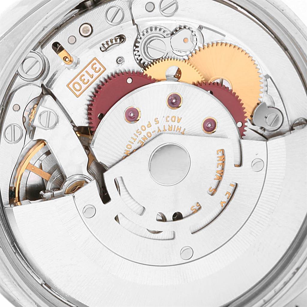 This image shows a close-up of the internal mechanism of the Rolex Air-King 114234 Men's Stainless Steel Silver Dial 114234 Men's Stainless Steel Silver Dial watch model, featuring gears and intricate components.