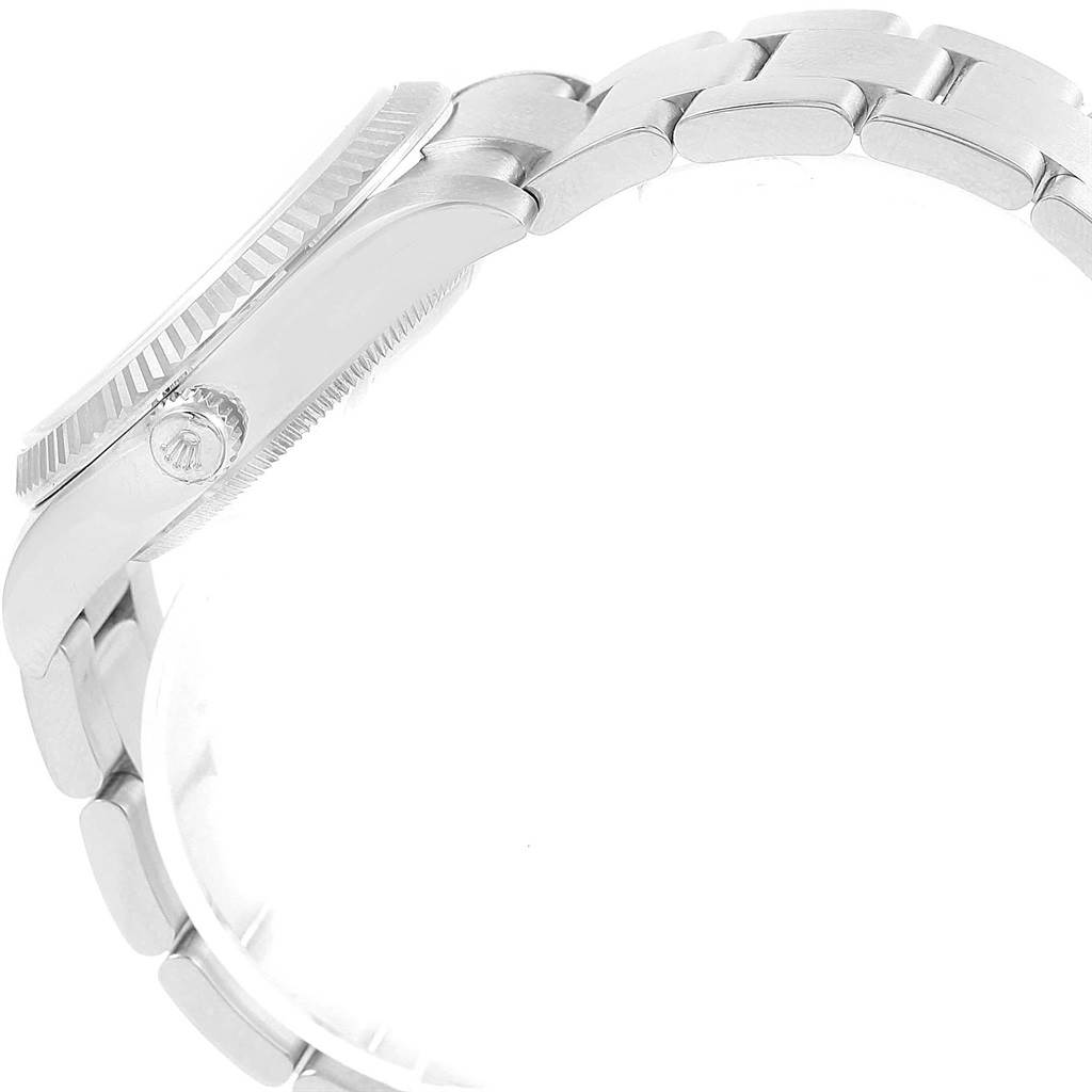 The image shows a side view of the Rolex Air-King 114234 Men's Stainless Steel Silver Dial 114234 Men's Stainless Steel Silver Dial watch, focusing on its crown, bezel, and bracelet.