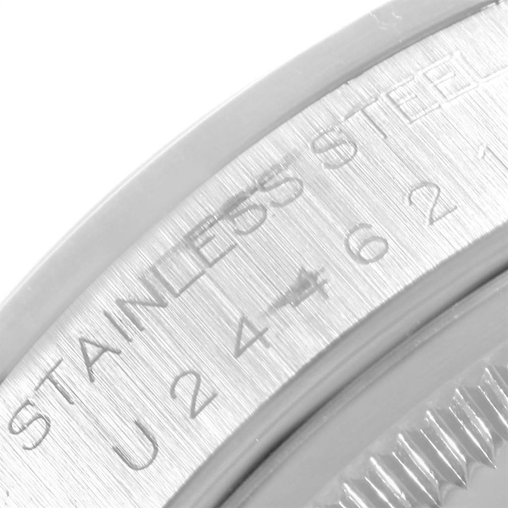 This close-up image of the Rolex Air-King 14000 Men's Stainless Steel Silver Dial 14000 Men's Stainless Steel Silver Dial shows the engraved serial and material information on the case side.