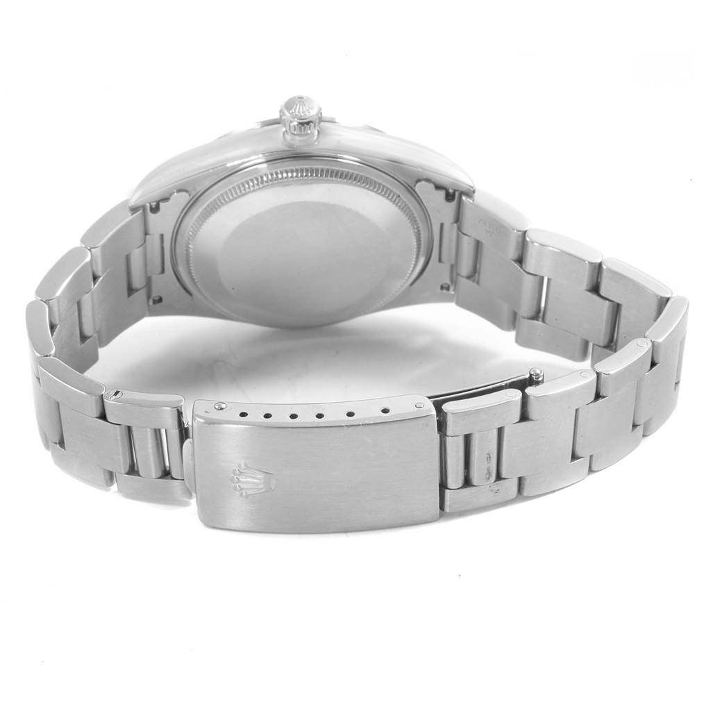 This image shows the back and bracelet of a Rolex Air-King 14000 Men's Stainless Steel Black Dial 14000 Men's Stainless Steel Black Dial watch laid flat.