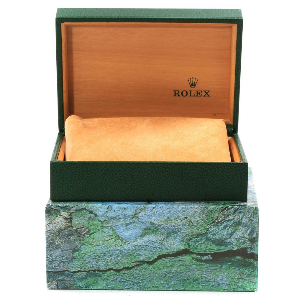 The image shows an empty Rolex watch box, likely for the Air-King model, with its lid open, revealing the logo and cushion.
