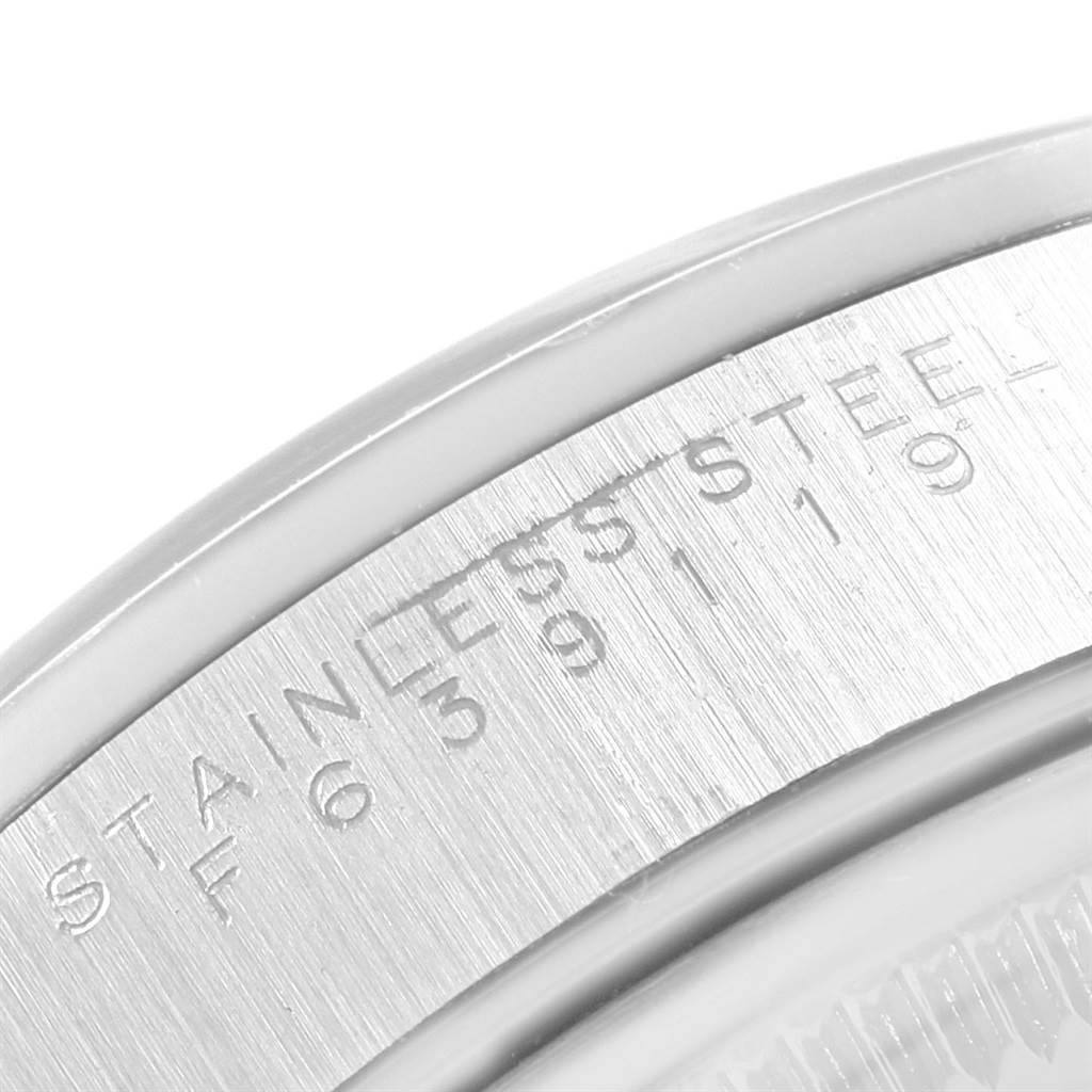 This close-up image shows the engraved details on the stainless steel bezel of a Rolex Air-King 14000 Men's Stainless Steel Silver Dial 14000 Men's Stainless Steel Silver Dial watch.