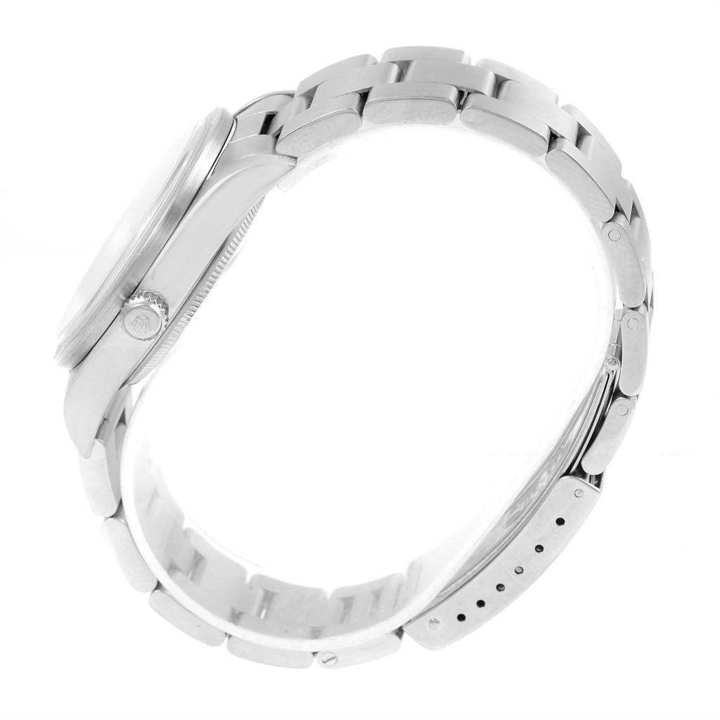 The image shows a side view of the Rolex Air-King 14010 Men's Stainless Steel Silver Dial 14010 Men's Stainless Steel Silver Dial watch, highlighting the case, crown, and stainless steel bracelet.