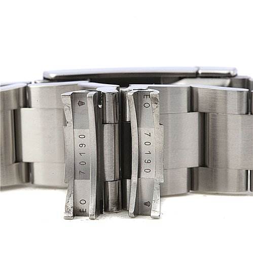 The image shows the clasp and part of the bracelet of a Rolex Air-King 114200 Men's Stainless Steel Silver Dial 114200 Men's Stainless Steel Silver Dial watch, highlighting the engraved model and serial numbers.