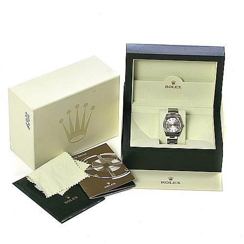 The image shows a Rolex Air-King 114200 Men's Stainless Steel Silver Dial 114200 Men's Stainless Steel Silver Dial watch displayed in its box, alongside the outer packaging, manuals, and a cleaning cloth.