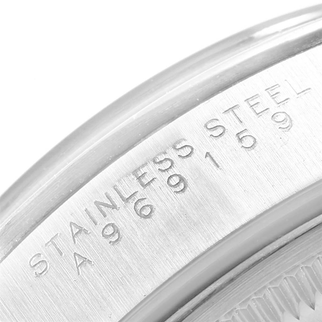 This image shows a close-up of the case side of a Rolex Air-King 14000 Men's Stainless Steel Blue Dial 14000 Men's Stainless Steel Blue Dial, featuring the "stainless steel" inscription and serial number.