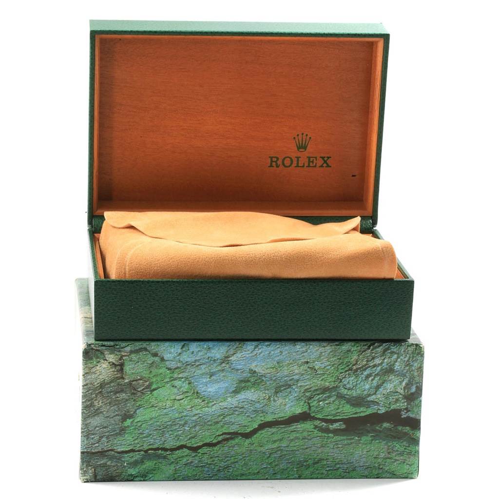 The image shows an open Rolex Air-King 14000 Men's Stainless Steel Blue Dial 14000 Men's Stainless Steel Blue Dial watch box with a tan cover for the watch inside.