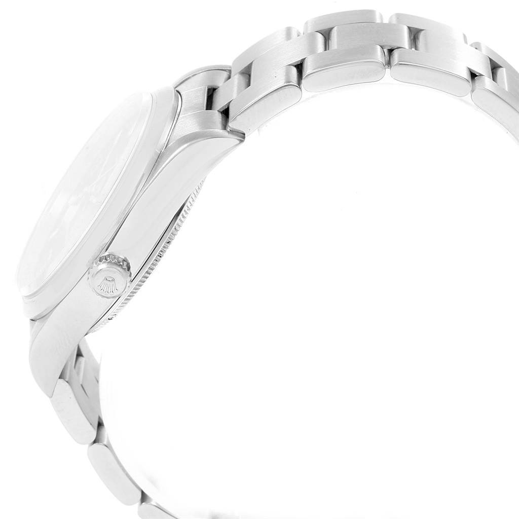 This side-angle view of the Rolex Air-King 14000 Men's Stainless Steel Blue Dial 14000 Men's Stainless Steel Blue Dial watch showcases its crown, case, and bracelet.