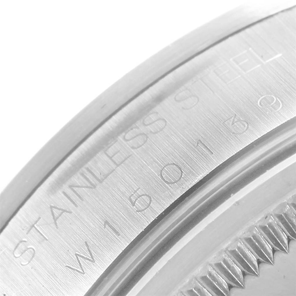 This close-up image shows the stainless steel casing of a Rolex Air-King 14000 Men's Stainless Steel Pink Dial 14000 Men's Stainless Steel Pink Dial watch, highlighting the engraved serial number.