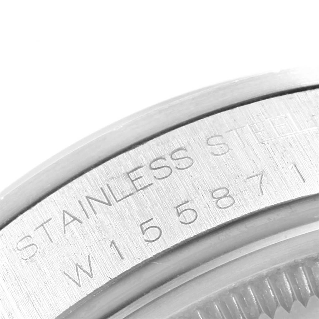 This close-up image shows the serial number and "STAINLESS STEEL" engraving on the case back of the Rolex Air-King 14000 Men's Stainless Steel Black Dial 14000 Men's Stainless Steel Black Dial watch.