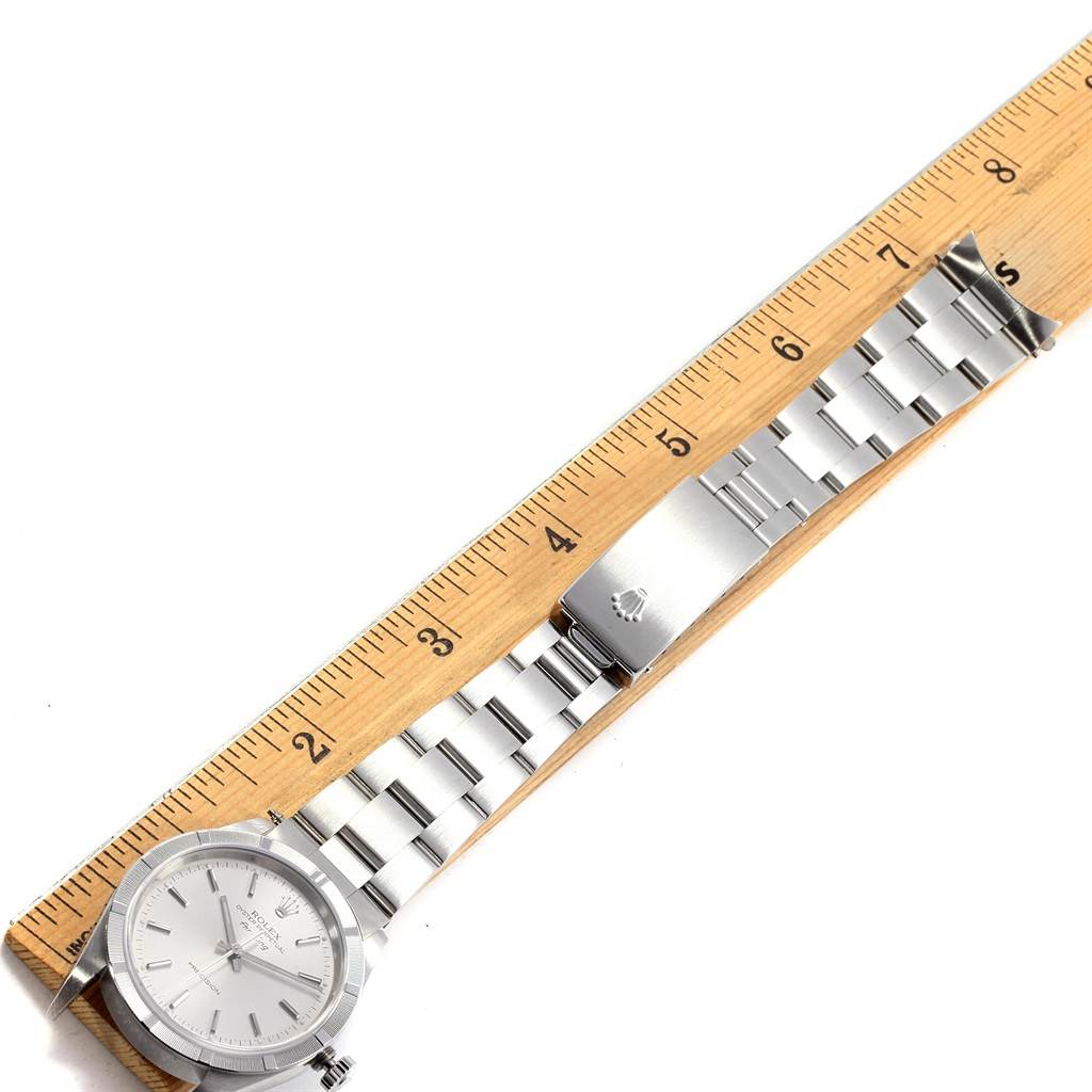 The image shows a Rolex Air-King 14010 Men's Stainless Steel Silver Dial 14010 Men's Stainless Steel Silver Dial watch laid flat next to a ruler, with a clear view of its face, bracelet, and clasp.