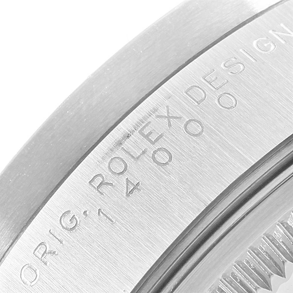 This image shows a close-up of the casing with engravings on a Rolex Air-King 14010 Men's Stainless Steel Silver Dial 14010 Men's Stainless Steel Silver Dial watch.