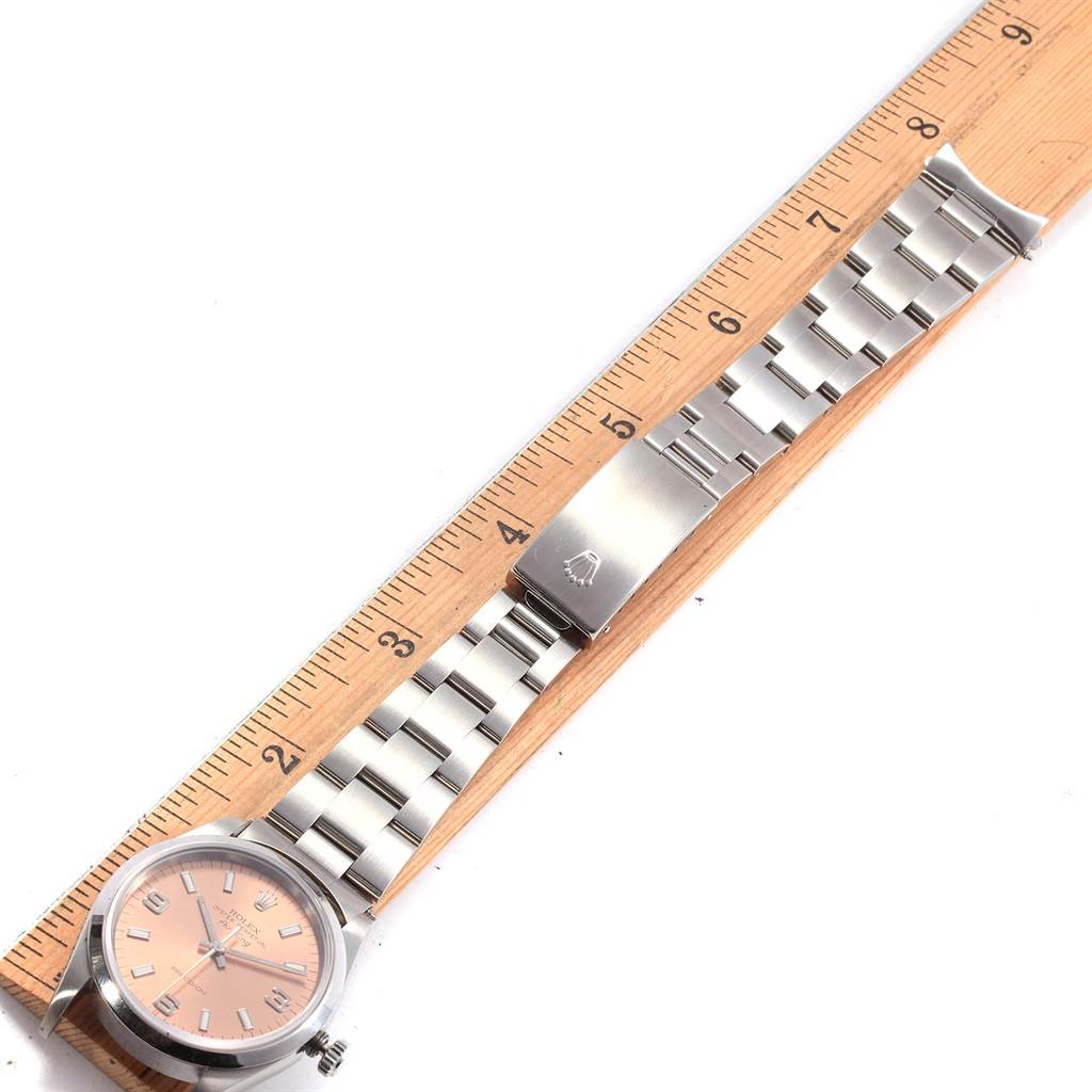 The image shows the Rolex Air-King 14000 Men's Stainless Steel Pink Dial 14000 Men's Stainless Steel Pink Dial watch laid flat, with a close-up angle highlighting the face, band, and clasp.