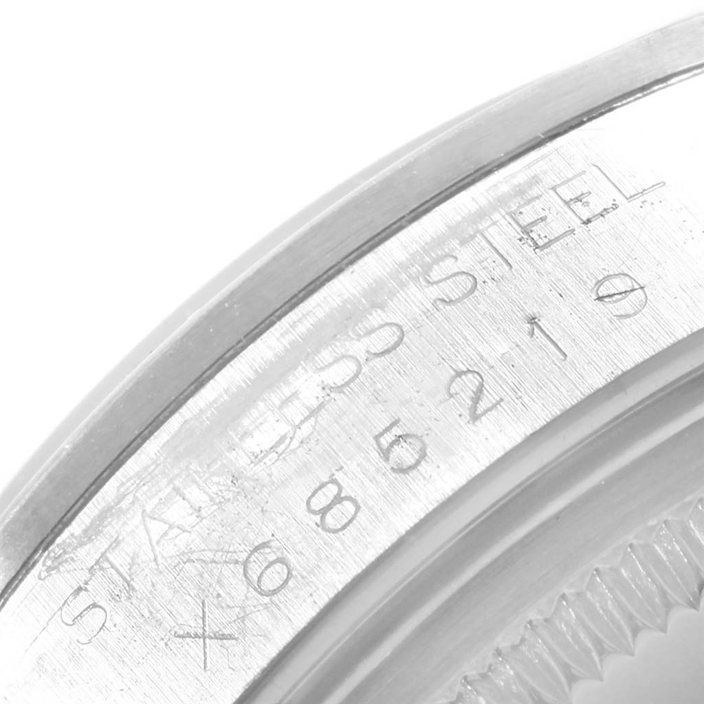 This close-up shows the engraved stainless steel bezel and part of the case back of the Rolex Air-King 14000 Men's Stainless Steel Pink Dial 14000 Men's Stainless Steel Pink Dial watch.