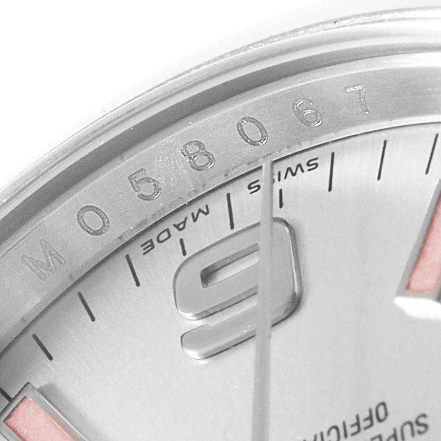 This close-up image shows part of the dial and serial number of the Rolex Air-King 114200 Stainless Steel Silver Dial 114200 Stainless Steel Silver Dial watch.
