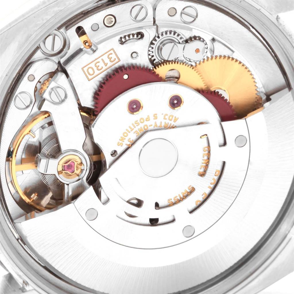 This image shows the intricate internal movement mechanism of the Rolex Air-King 114200 Stainless Steel Silver Dial 114200 Stainless Steel Silver Dial watch from a close-up, angled top view.