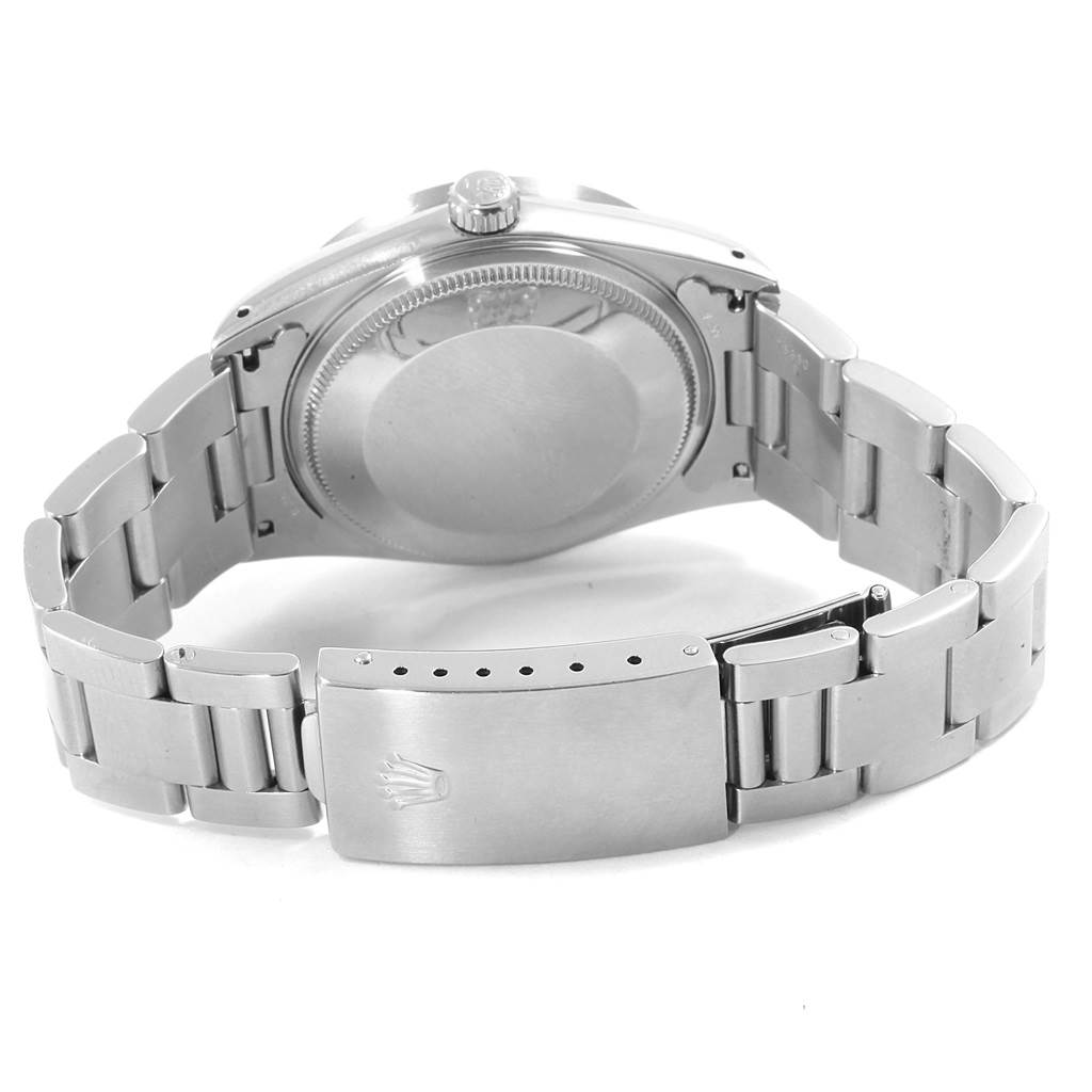 The image shows the back of the Rolex Air-King 14010 Men's Stainless Steel Blue Dial 14010 Men's Stainless Steel Blue Dial watch, detailing the case back, crown, and partially open metal bracelet.