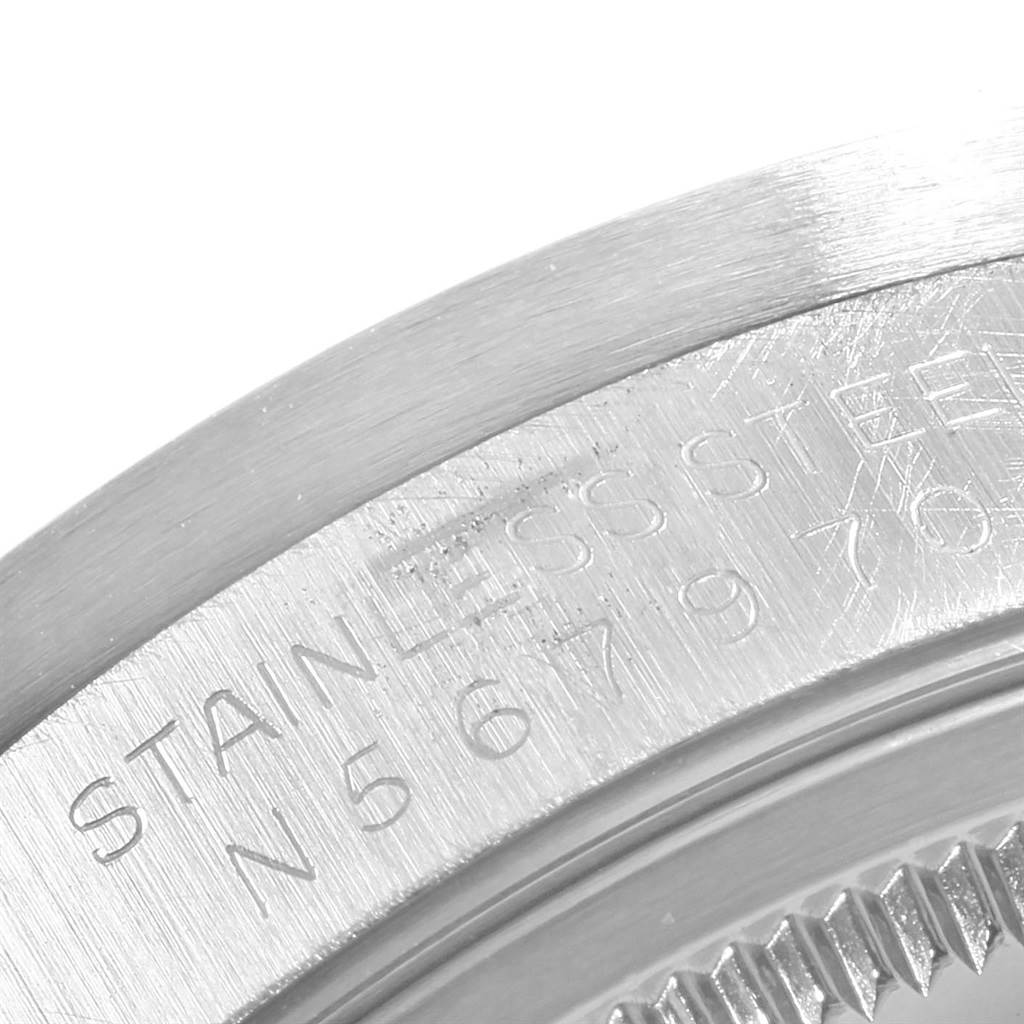 The image shows a close-up angle of the Rolex Air-King 14010 Men's Stainless Steel Blue Dial 14010 Men's Stainless Steel Blue Dial watch case, highlighting the engraving on the stainless steel surface.