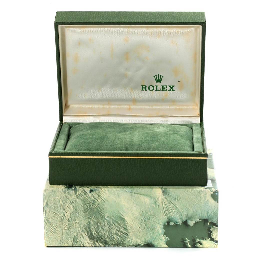 The image shows an open green Rolex box for an Air-King model, viewed from the front, with a cushion inside for the watch.