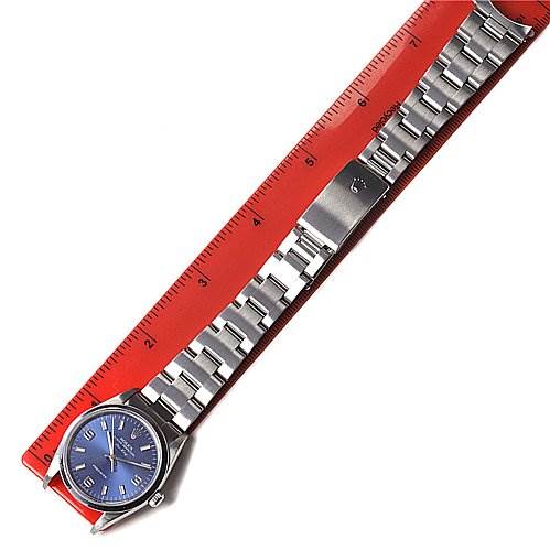 The Rolex Air-King 14000 Men's Stainless Steel Blue Dial 14000 Men's Stainless Steel Blue Dial watch is displayed from a top-down angle, showing the entire bracelet and blue dial, with a ruler beneath it for measurement.