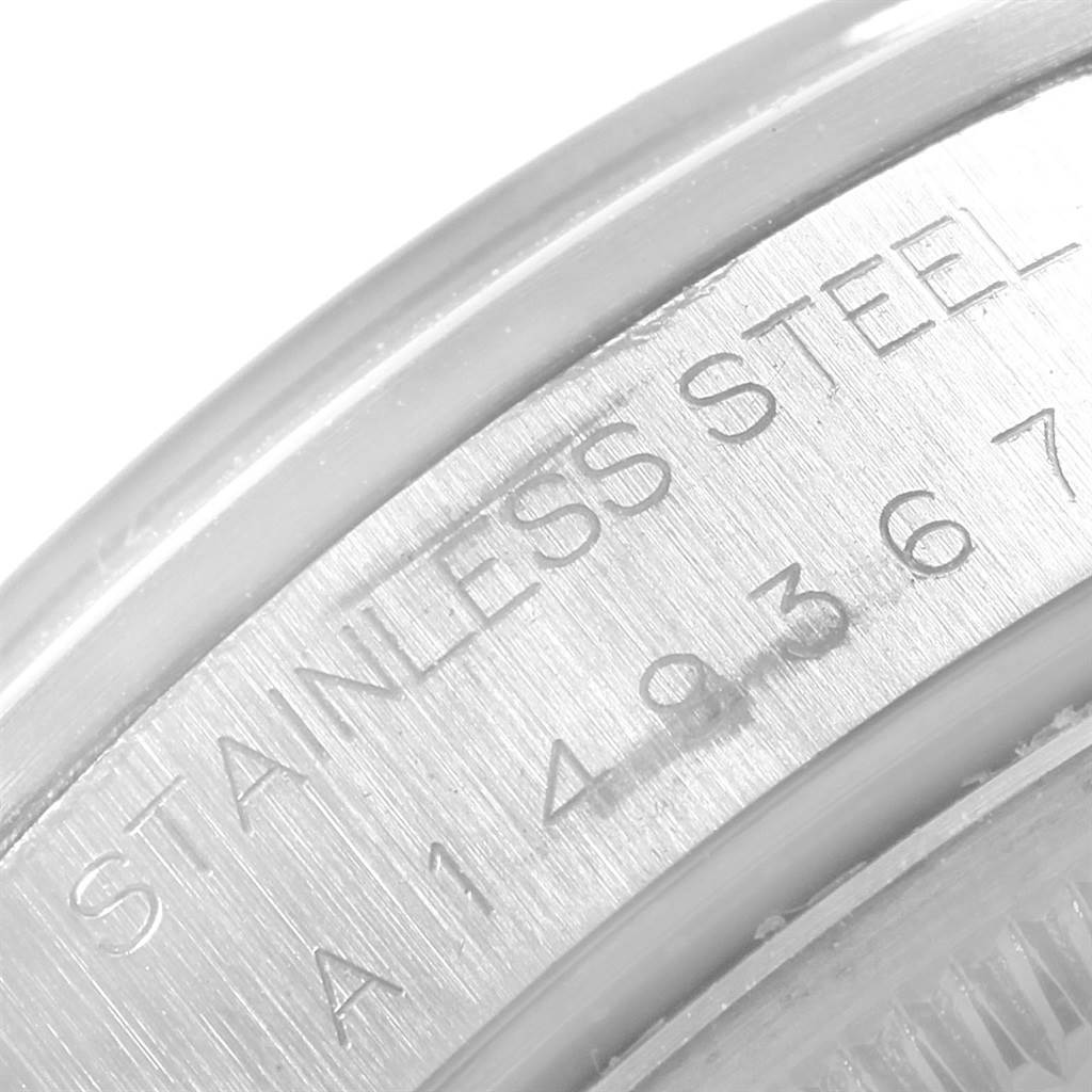 The image shows a close-up of the stainless steel case of the Rolex Air-King 14000 Men's Stainless Steel Blue Dial 14000 Men's Stainless Steel Blue Dial watch, highlighting the engraved serial number.