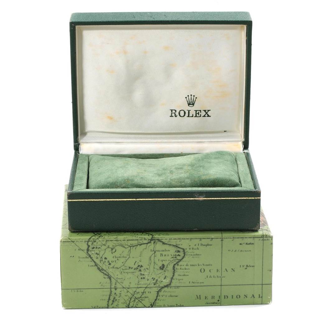 This is an image of a Rolex Air-King 14000 Men's Stainless Steel Blue Dial 14000 Men's Stainless Steel Blue Dial watch box taken from the front, showing the open case with the Rolex logo inside and a cushion where the watch sits.