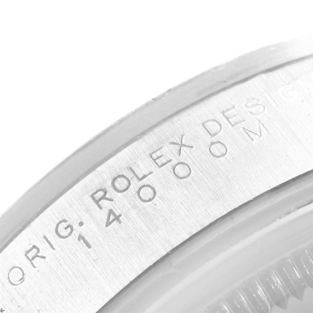 The image is a close-up of the bezel and edge of the case, showing "Rolex" and the model number 14000M of the Air-King by Rolex.