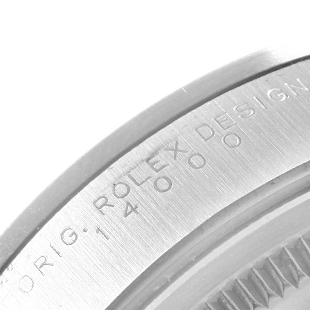 This image shows a close-up of the bezel on a Rolex Air-King Men's Stainless Steel Silver Dial Men's Stainless Steel Silver Dial watch, highlighting the engraved text.