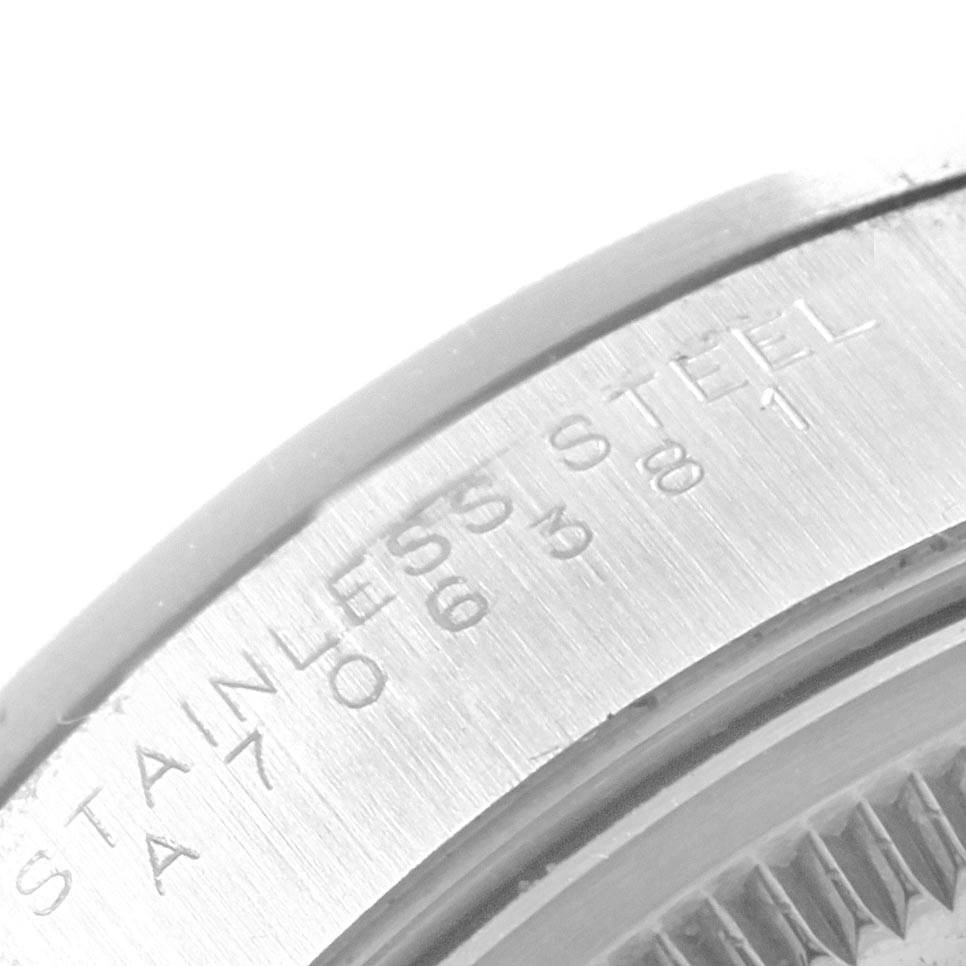 This close-up shows the engraved text on the stainless steel back of the Rolex Air-King Men's Stainless Steel Silver Dial Men's Stainless Steel Silver Dial watch.