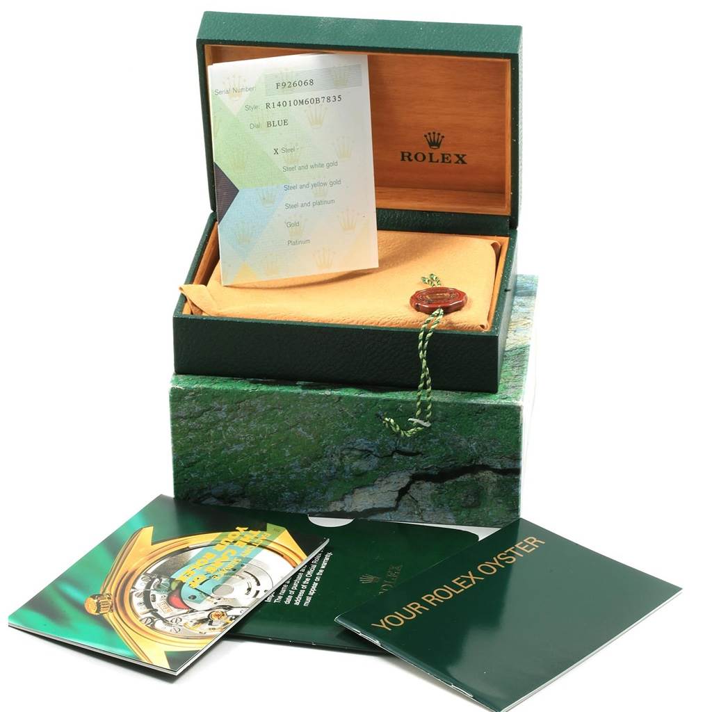 The image shows a Rolex Air-King 14010 Men's Stainless Steel Blue Dial 14010 Men's Stainless Steel Blue Dial watch box with accompanying booklets and a tag, viewed from a slightly elevated angle.