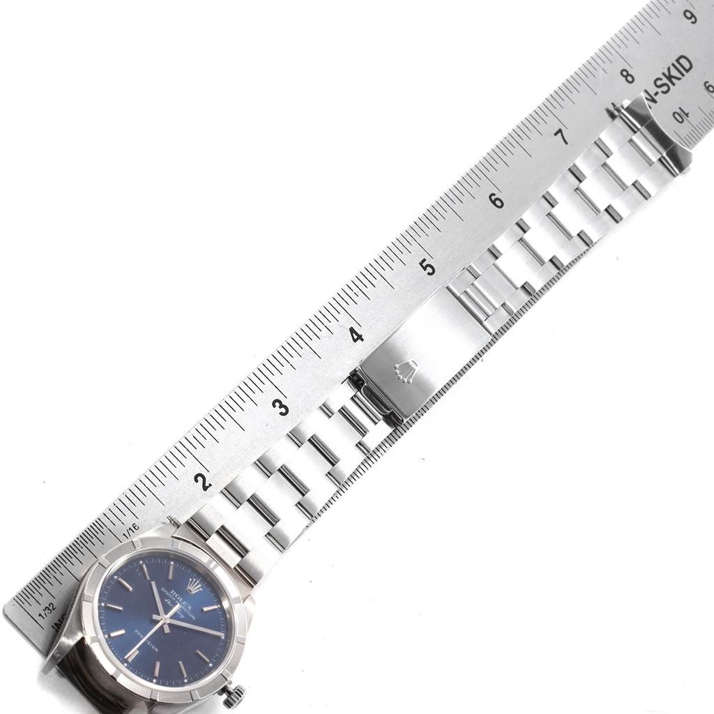 The image shows a Rolex Air-King 14010 Men's Stainless Steel Blue Dial 14010 Men's Stainless Steel Blue Dial watch, laying flat next to a ruler, displaying its face and entire bracelet.
