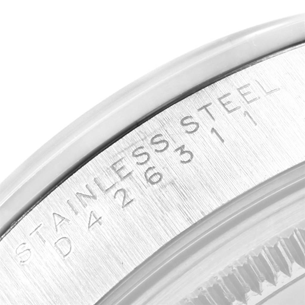 This image shows a close-up of the side engraving on a Rolex Air-King 14000 Men's Stainless Steel White Dial 14000 Men's Stainless Steel White Dial watch, displaying the stainless steel information and part of the serial number.