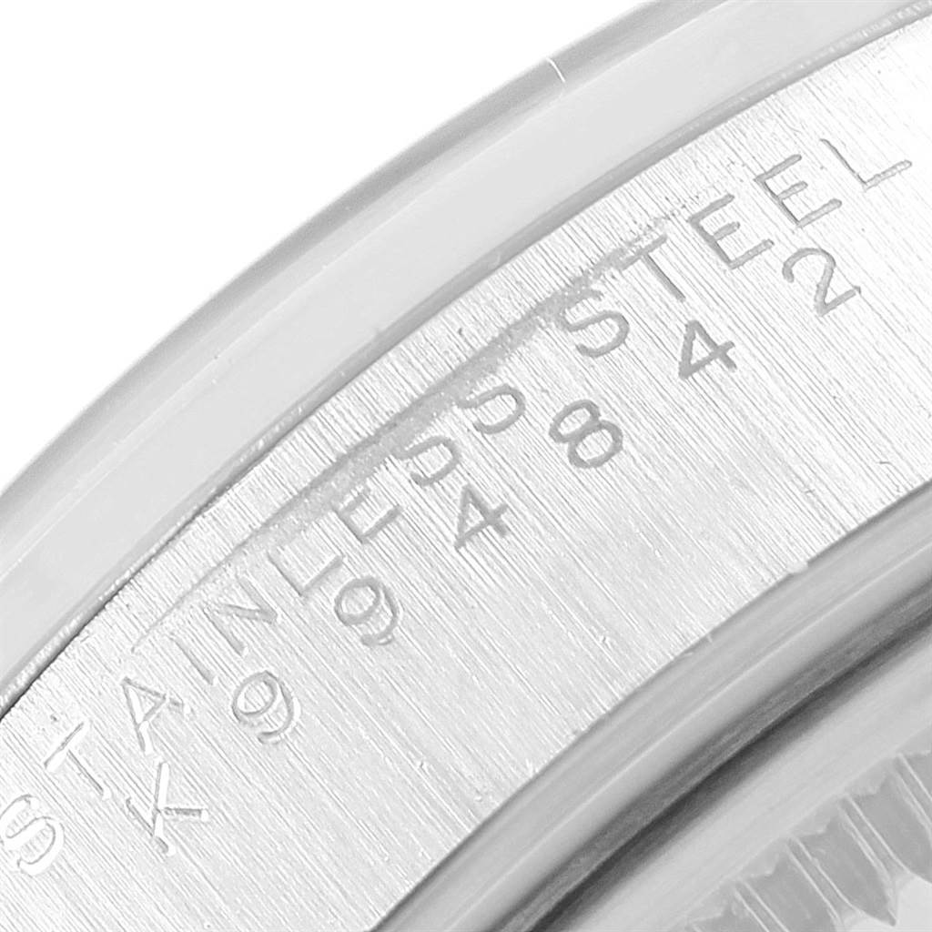A close-up angle of the Rolex Air-King 14000 Men's Stainless Steel White Dial 14000 Men's Stainless Steel White Dial watch displaying the inner bezel with engraved text and serial numbers.