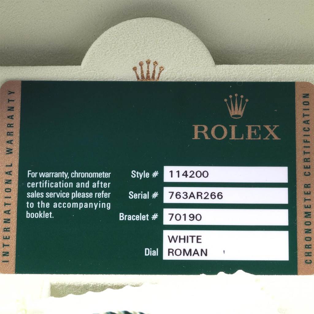 The image shows an international warranty card for the Rolex Air-King 114200 Men's Stainless Steel White Dial 114200 Men's Stainless Steel White Dial model, displaying style, serial, and bracelet numbers, alongside dial information.