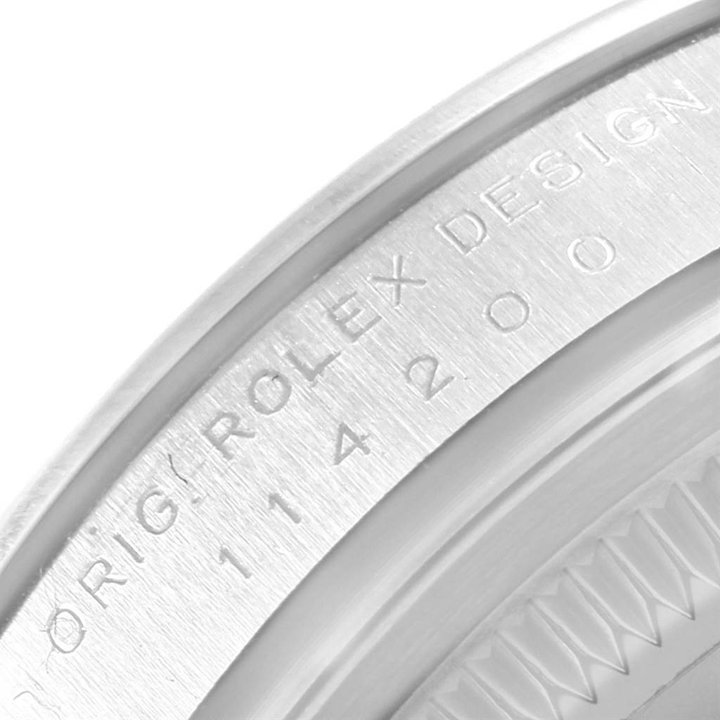 This image shows a close-up of the engraved bezel edge of a Rolex Air-King 114200 Men's Stainless Steel White Dial 114200 Men's Stainless Steel White Dial watch.