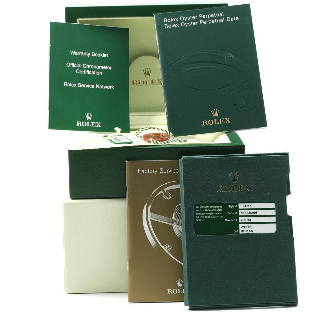 The image shows Rolex Air-King 114200 Men's Stainless Steel White Dial 114200 Men's Stainless Steel White Dial packaging, including manuals, warranty booklets, and a service booklet, all in various angles.