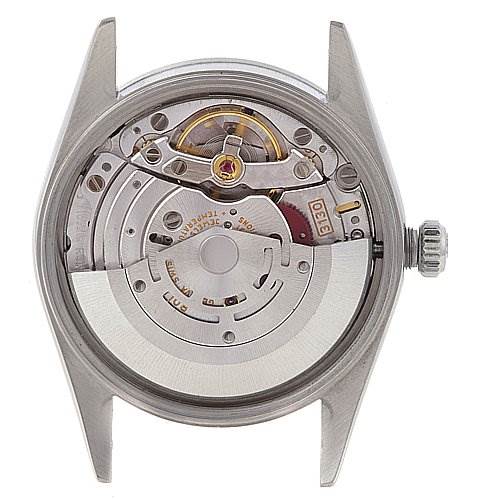 This image shows the back view of a Rolex Air-King 14000M Men's Stainless Steel Blue Dial 14000M Men's Stainless Steel Blue Dial watch, revealing its internal mechanical movement components.