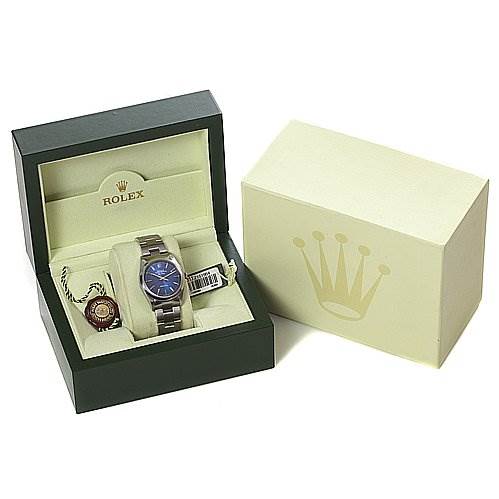The image shows a Rolex Air-King 14000M Men's Stainless Steel Blue Dial 14000M Men's Stainless Steel Blue Dial watch and accessories from a front angle, displayed in an open box beside its outer packaging.