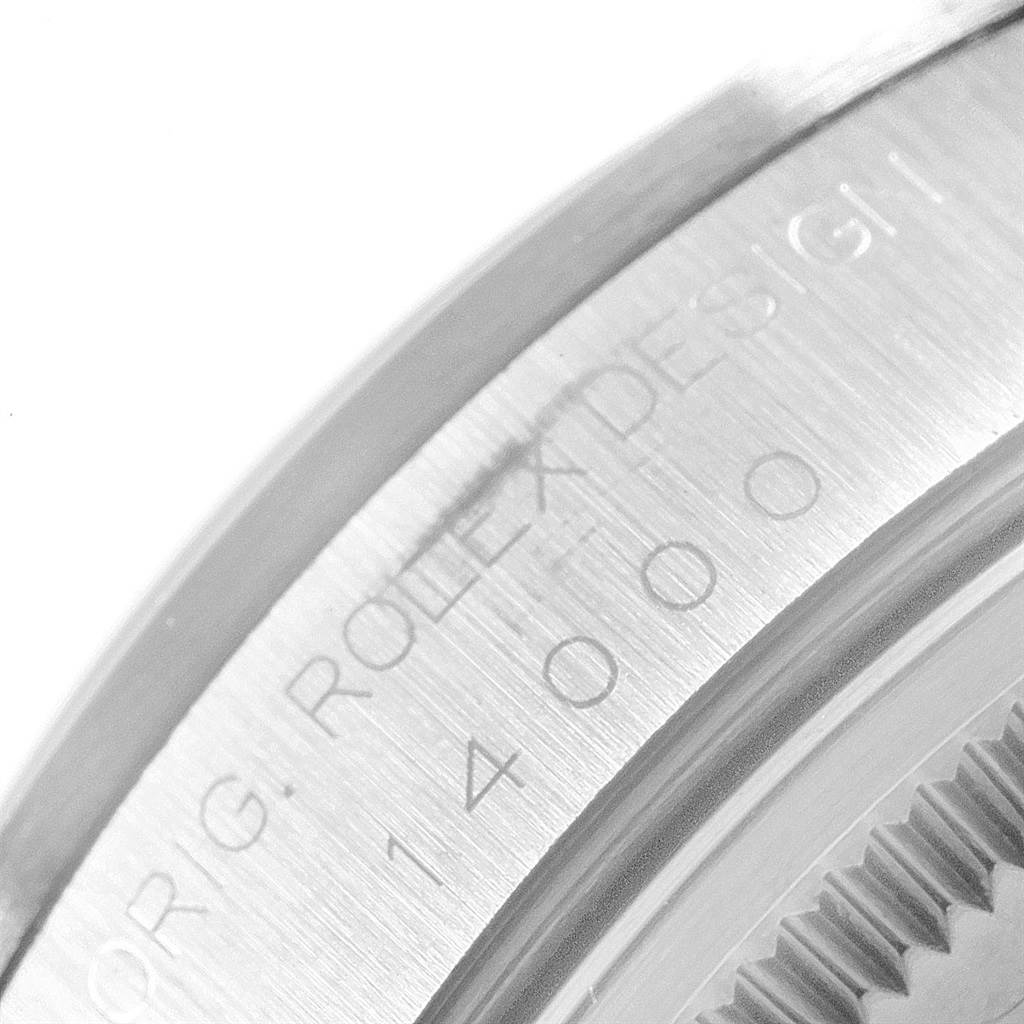This image shows a close-up of the engraved side of the Rolex Air-King 14000 Men's Stainless Steel Blue Dial 14000 Men's Stainless Steel Blue Dial watch casing, including the model number.