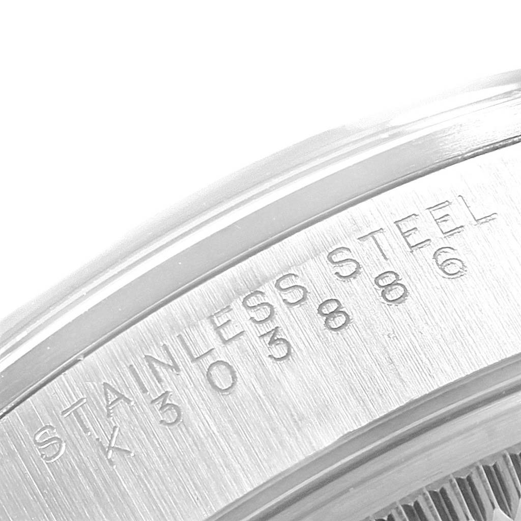 This close-up angle shows the engraved serial number and "STAINLESS STEEL" inscription on the side of a Rolex Air-King 14000 Men's Stainless Steel Silver Dial 14000 Men's Stainless Steel Silver Dial watch.