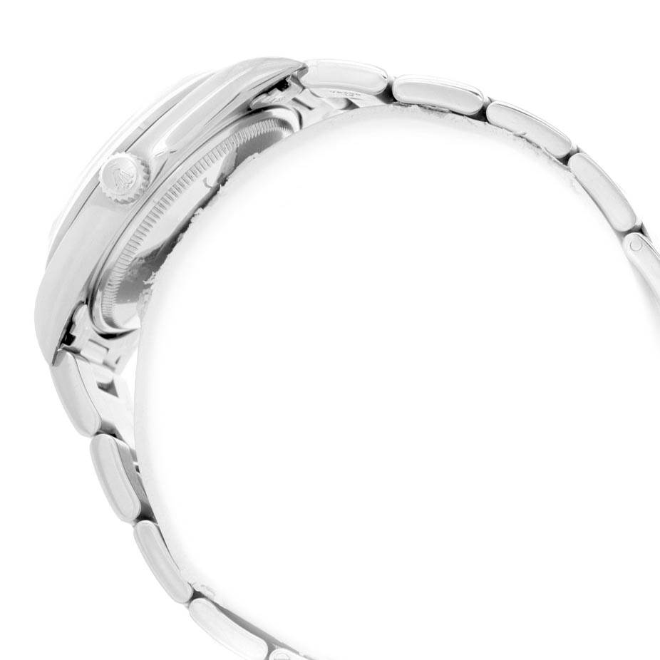 This image shows a side view of the Rolex Air-King 14000 Men's Stainless Steel White Dial 14000 Men's Stainless Steel White Dial watch, focusing on the case, crown, and part of the bracelet.